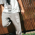 NBL Player Nelson Kahler wearing the Courtside Bench Track Pants in Faded Grey colour.