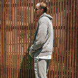 NBL Player Nelson Kahler wearing the Courtside Bench Track Pants in Faded Grey colour.