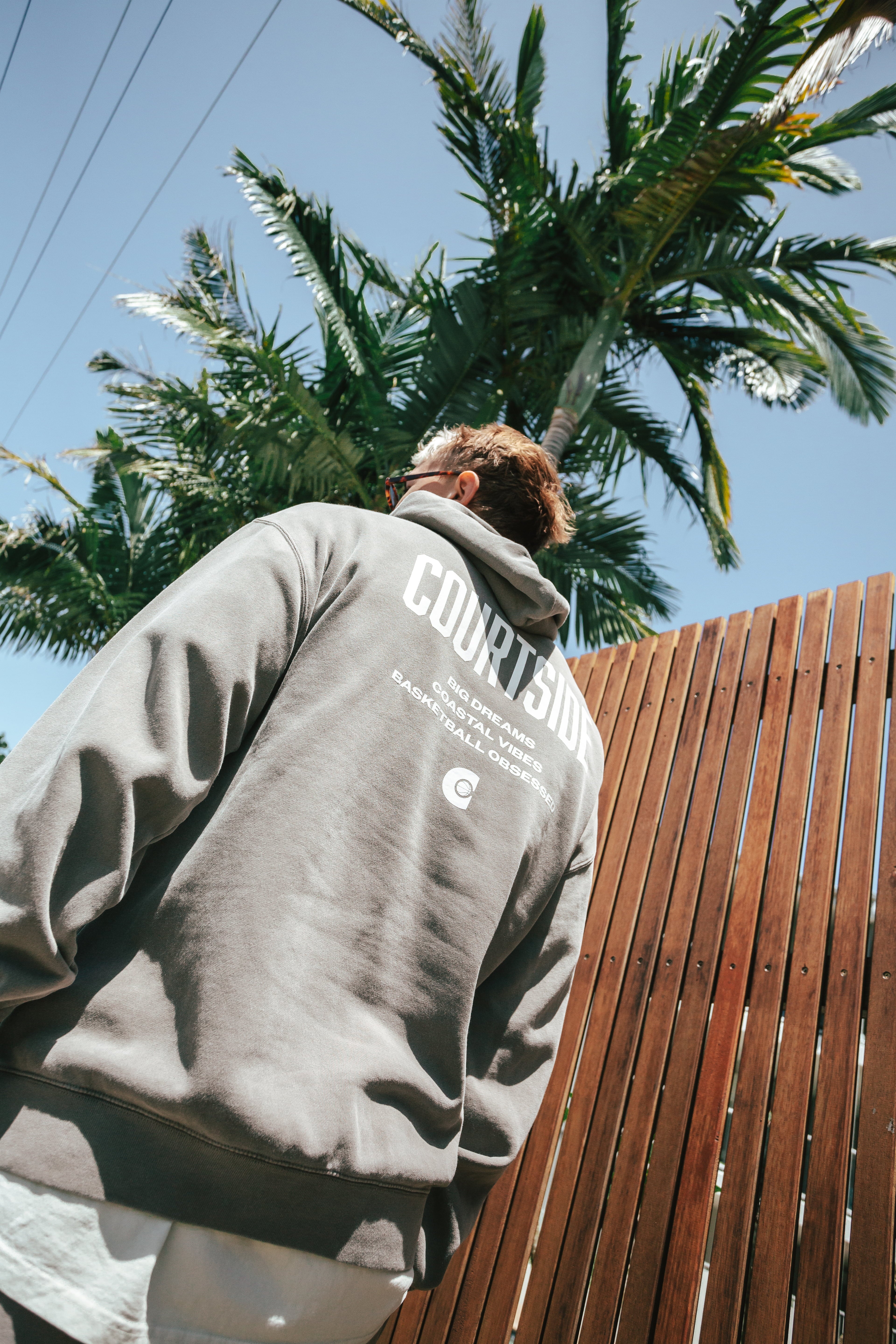 NBL Player Nelson Kahler wearing the Courtside Big Dreams Hoodie in Faded Grey colour.