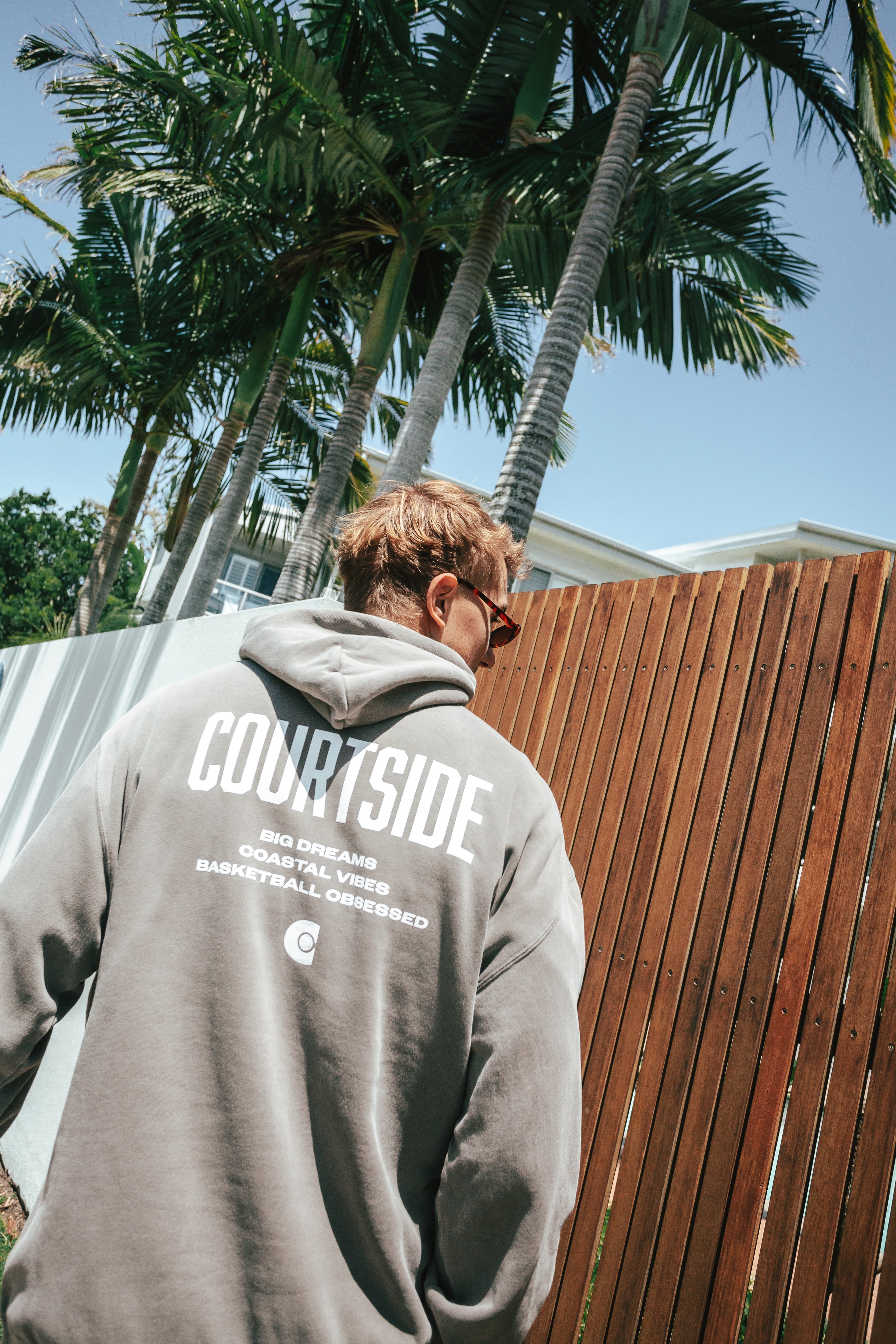 NBL Player Nelson Kahler wearing the Courtside Big Dreams Hoodie in Faded Grey colour.