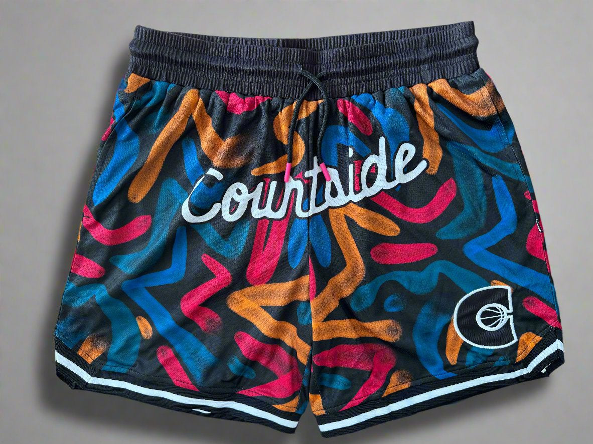 Courtside black, burnt orange, dark pink and blues ROTY basketball shorts layed flat showing details