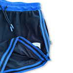 DPOYW Women's cut Courtside basketball short in Black & royal blue showing close up & lining detail as a flat lay