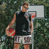 Courtside DPOY basketball shorts with CRT SDE letters in bold across front leg shown on Nelson Kahler NBL player holding basketball on hip