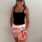 MVPW Courtside orange and white patterned short cut shorts shown on model size S