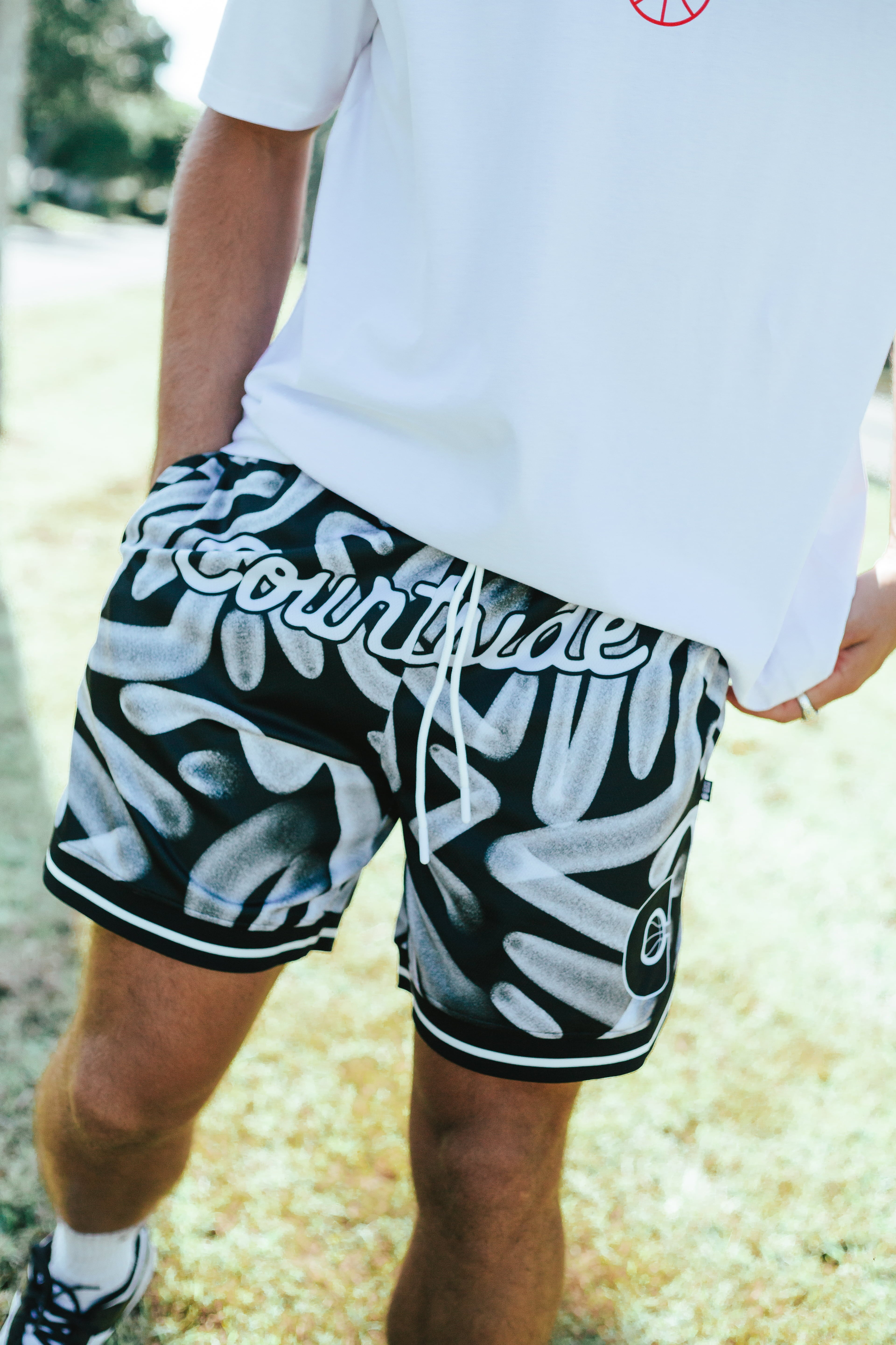 Courtside ROTY basketball shorts shown on Nelson NBL player with the white hoopers tee on