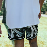 Courtside ROTY basketball shorts shown on Nelson NBL player from behind walking