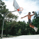 Courtside ROTY basketball shorts shown on Nelson NBL player shirtless flying through the air performing a dunk