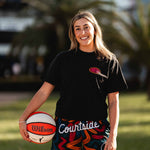 female basketballer wearing ROTY black and coloured basketball shorts and streetball tee on streetball court