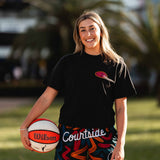 female basketballer wearing ROTY black and coloured basketball shorts and streetball tee on streetball court