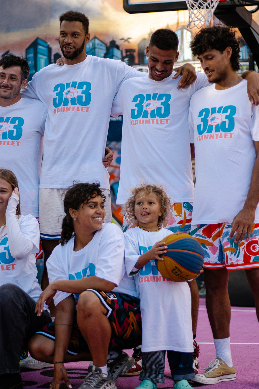 Livai Smith and Matthew Keonig 3X3 players wearing 3X3 Courtside Gauntlet tee with other basketball players 