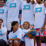 Livai Smith and Matthew Keonig 3X3 players wearing 3X3 Courtside Gauntlet tee with other basketball players 