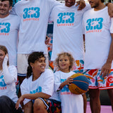 Livai Smith and Matthew Keonig 3X3 players wearing 3X3 Courtside Gauntlet tee with other basketball players 