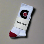 Pair of white socks with pink ball in a black C hoop logo, pink toes and heels shown in packaging
