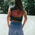 Bright blue shorts shown on a female from behind, mid thigh length with side pockets.