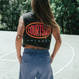 Bright blue shorts shown on a female from behind, mid thigh length with side pockets.