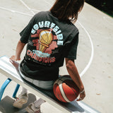 Gabi wearing the Courtside Champs Tee in Faded Black colour.