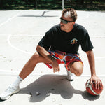 NBL Player Nelson Kahler wearing the Courtside Champs Tee in Faded Black colour.