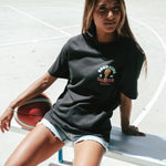 Gabi wearing the Courtside Champs Tee in Faded Black colour.