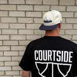 COURTSIDE black tee with white large print on back. Shown with Courtside script white hat.