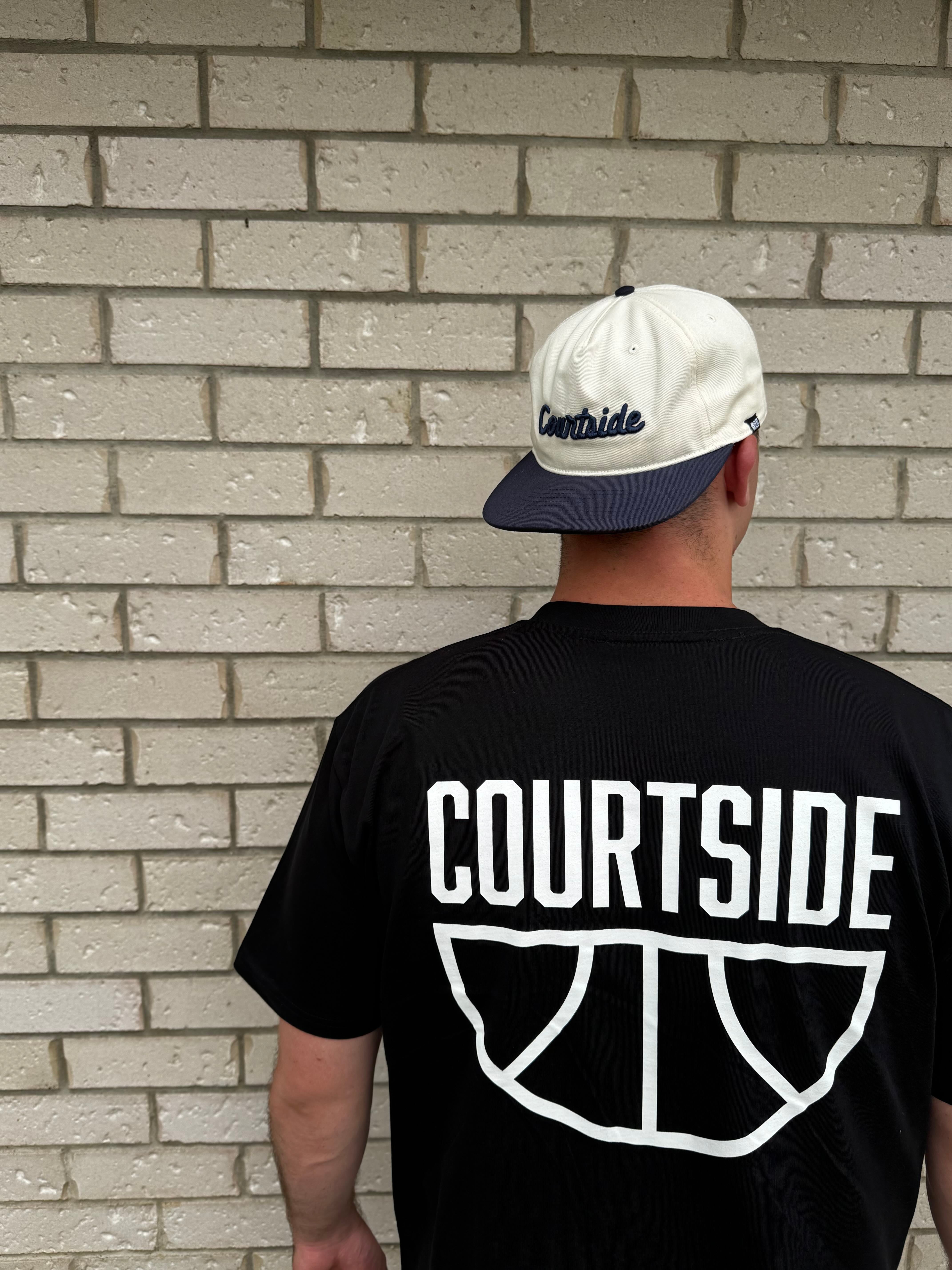 COURTSIDE black tee with white large print on back. Shown with Courtside script white hat.