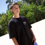 COURTSIDE black tee with white large print on back. Shown with Courtside script white hat.