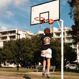 basketball player wearing champs tee shown hooping