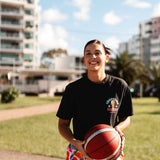 champs tee shirt showing front with female basketball player holding basketball