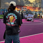 showing back of the champs tee worn on melbourne hooper and freestyle rapper whilst watching community basketball competition