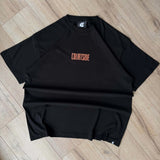 Black t-shirt with 'COURTSIDE' text on a wooden floor