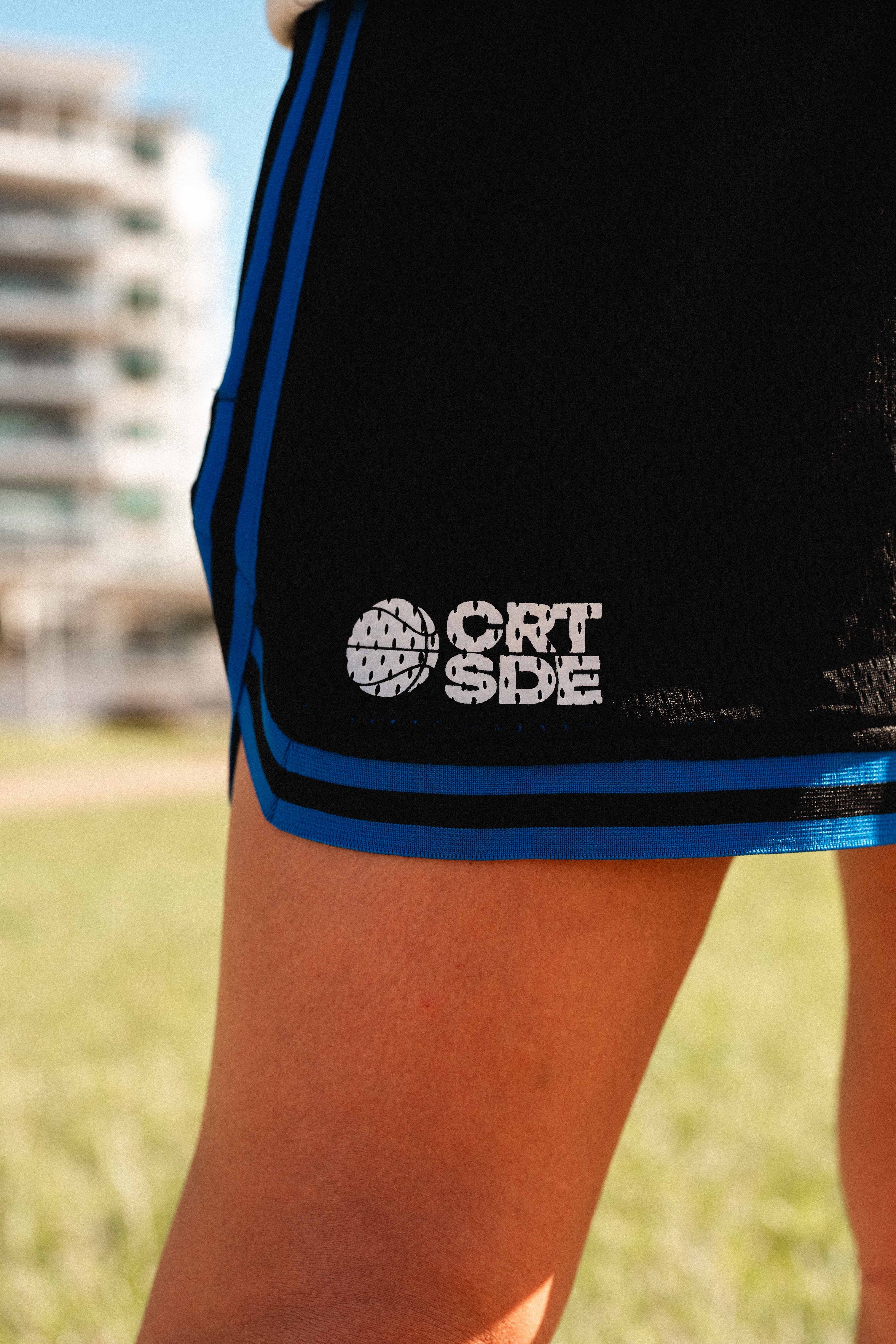 Courtside Black & Royal Blue DPOYW basketball short in women's cut showing details
