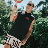 Courtside DPOY basketball shorts with CRT SDE letters in bold across front leg shown on Nelson Kahler NBL player spinning basketball on finger