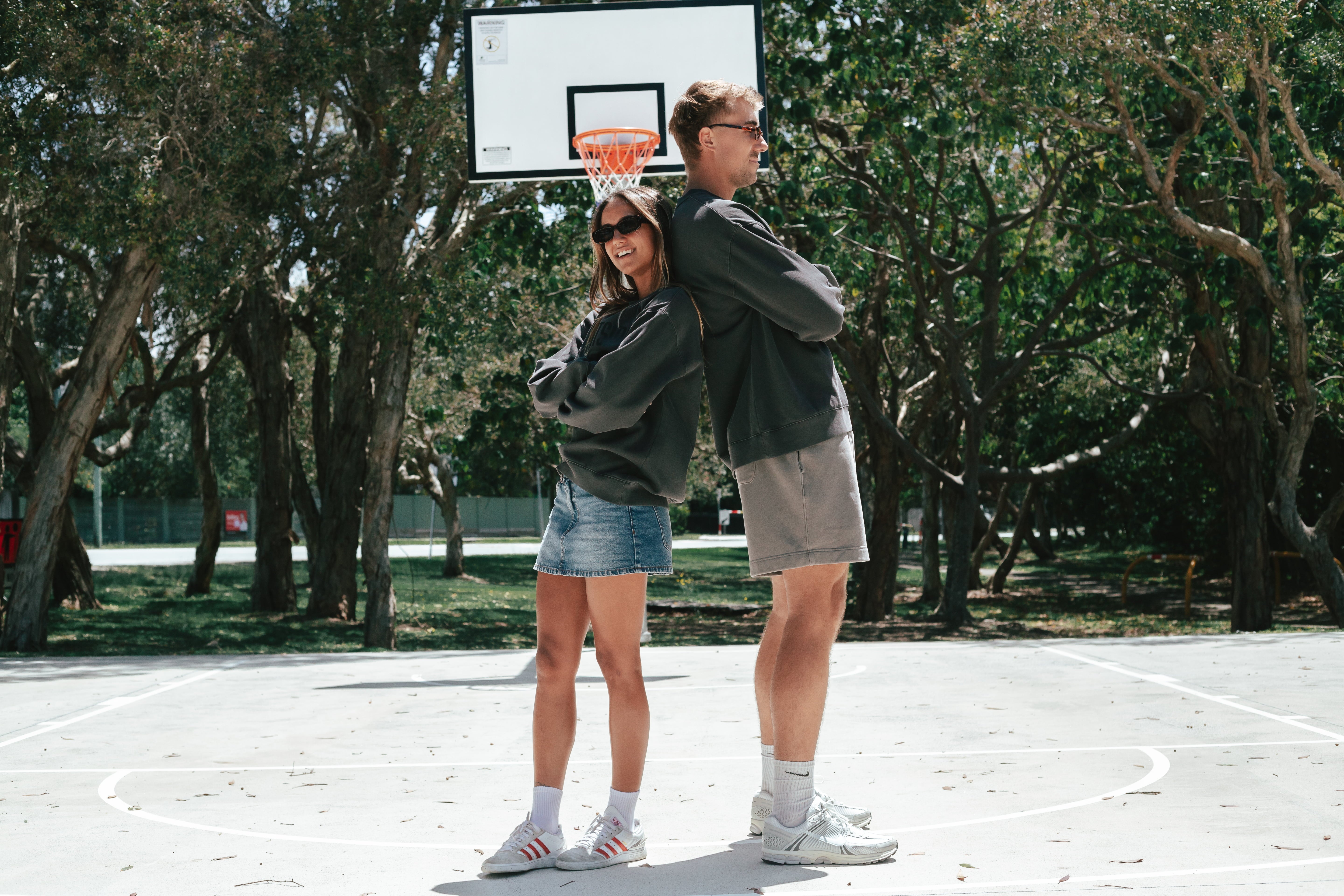 NBL Player Nelson Kahler and Gabi wearing the Courtside Half Court Crew in Faded Black colour.