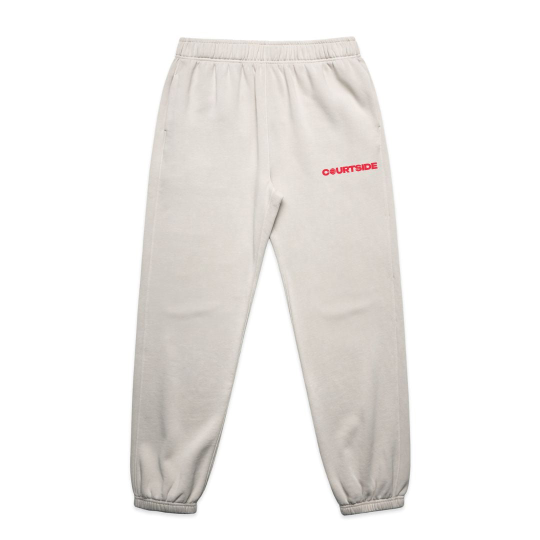 Bone tracksuit pant with small red logo detail flat on white background