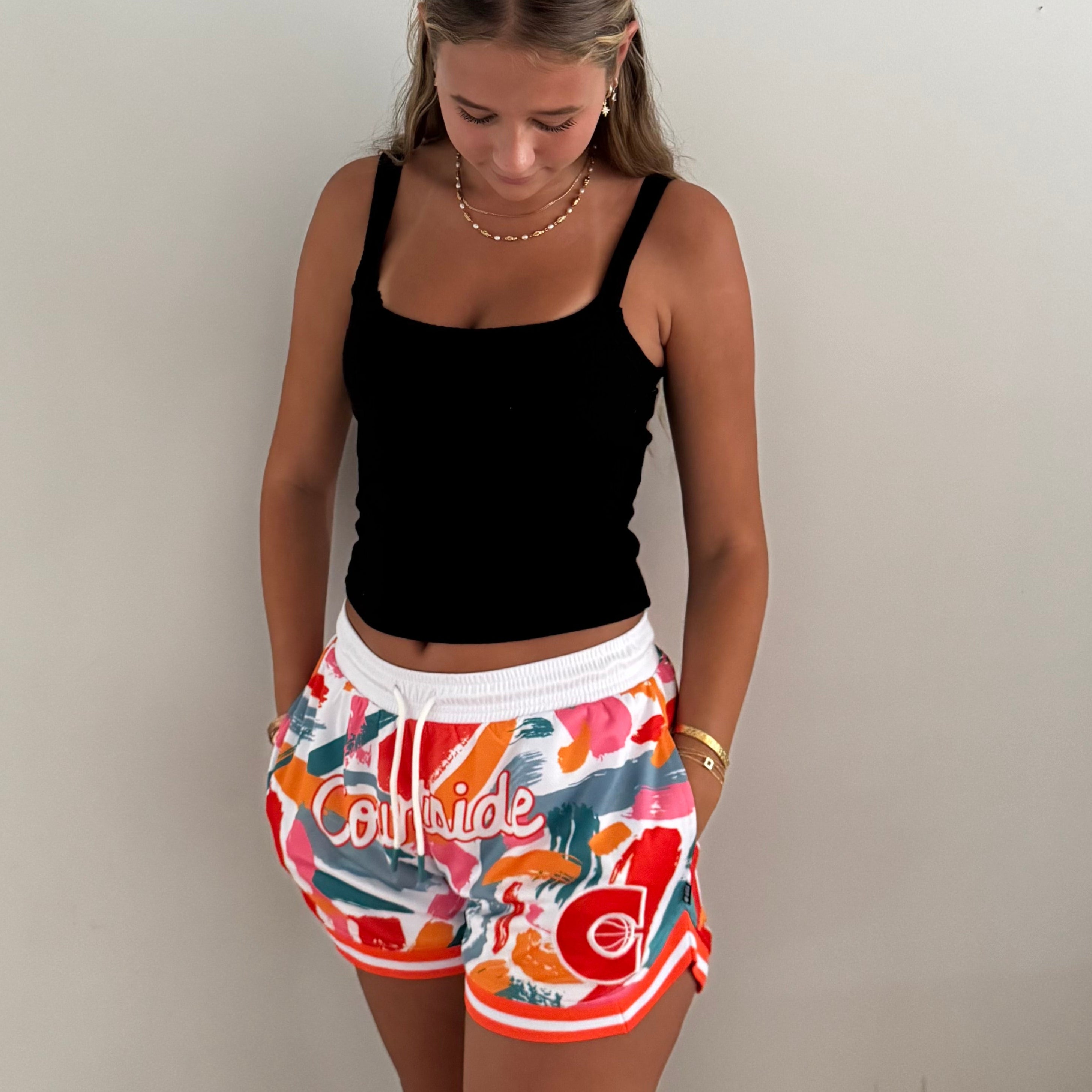 MVPW Courtside orange and white patterned short cut shorts shown on model size S