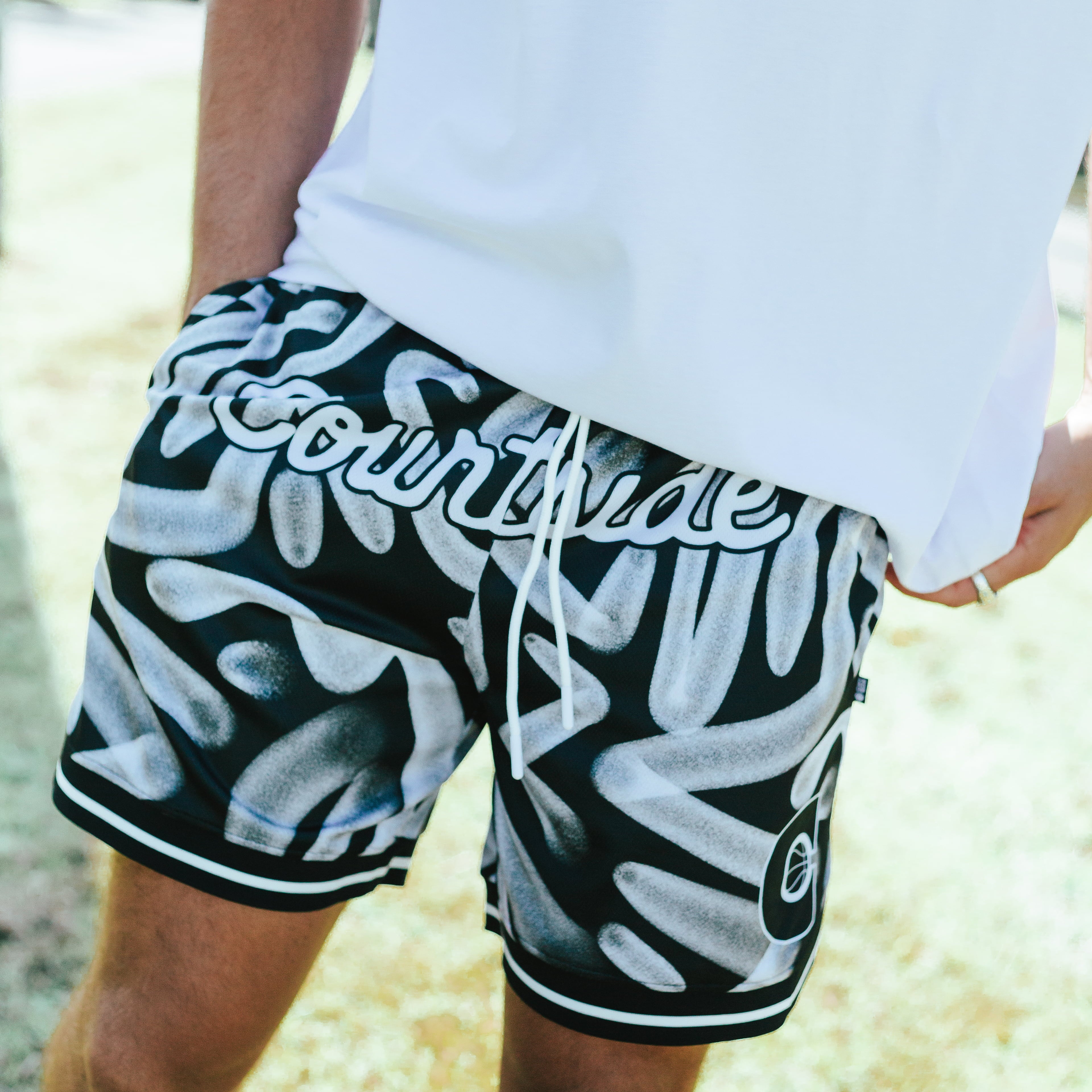 Courtside ROTY basketball shorts shown on Nelson NBL player with the white hoopers tee on