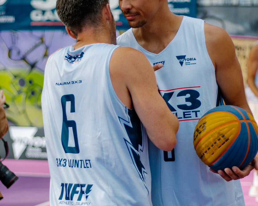 picture of 2 elite baskteball players embracing after a game showing their love for the game and love for their team mate